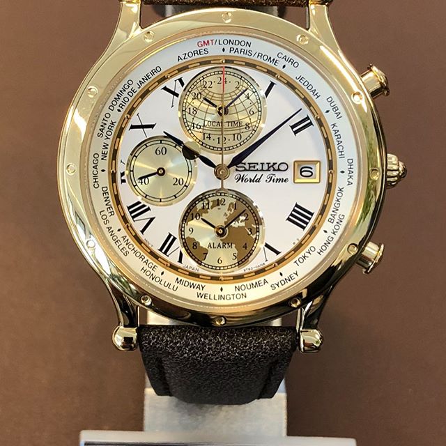 Seiko SPL060P1 Age of Discovery World Time Chronograph Analog White Dial  Gold Stainless Steel Case Brown Leather Strap Watch
